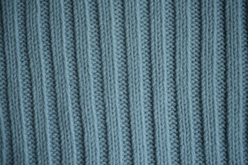 blue texture of knitted fabric, macro texture of blue woolen fabric, geometric knitted pattern of crocheted elastic as a background