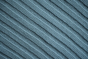 blue texture of knitted fabric, macro texture of blue woolen fabric, geometric knitted pattern of crocheted elastic as a background
