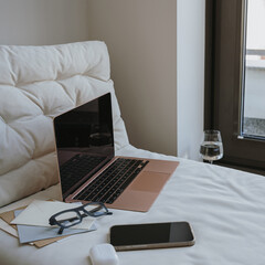 Cozy Home Office Setup with Laptop and Tech Accessories