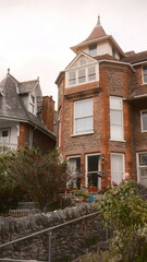 A highly detailed, professional photograph of a house with a clock on the side of it captured with artistic lighting and excellent composition. the scene features  under moody and dramatic conditions.