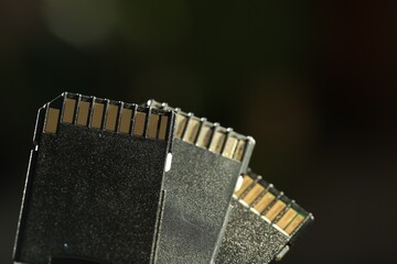 SD memory cards on blurred background, closeup