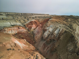 Rich colors and dramatic slopes of Aktumsuk hills in Karakalpakstan, Uzbekistan