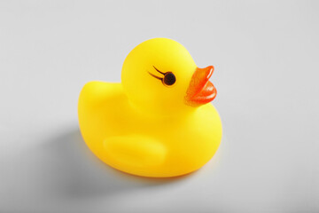 One cute rubber duck on white background, closeup