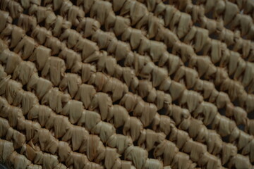 macro texture of summer brown paper hat as background, close up texture of panama hat, paper for panama hat	
