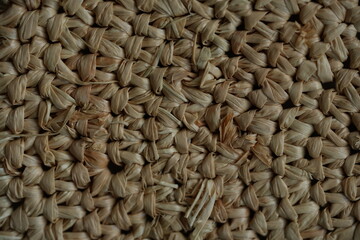 macro texture of summer brown paper hat as background, close up texture of panama hat, paper for panama hat	
