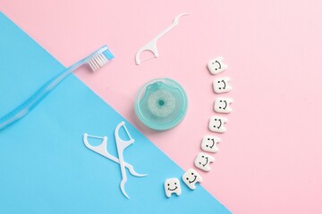 Different oral care products and teeth figures on color background, flat lay