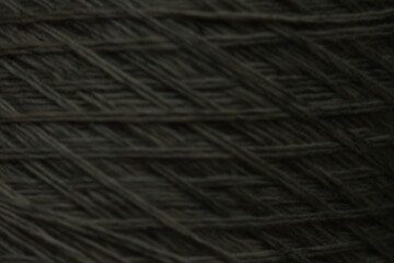 dark grey macro texture of linen threads on the background, gray macro texture of threads