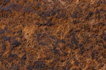 Close-up of rough textured rusted iron surface
