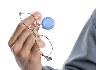 Man with glasses and contact lenses on white background, closeup