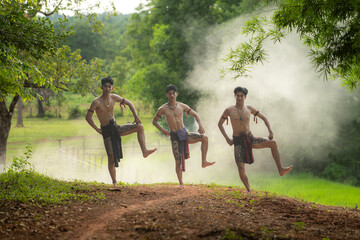 A farmer and a rice worship ritual with a group of traditional dancers