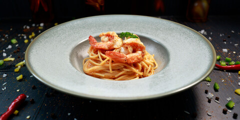 close up of a plate of pasta with shrimp inside