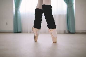 Close up of classic ballet dancer in pointe position 
