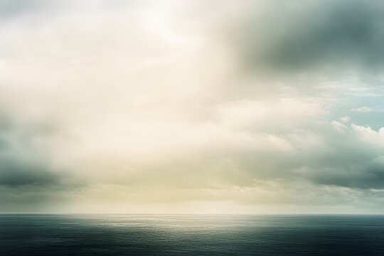 Serene seascape depicting a dramatic sky filled with fluffy clouds over tranquil ocean waters