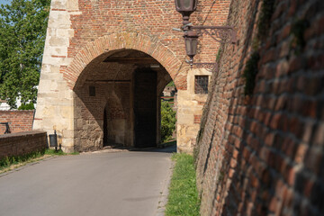 Naklejka premium Historic brick arch with stonework at a quiet entrance to a courtyard. Serbia. Belgrade