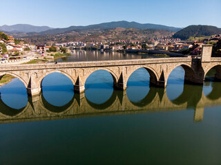 Exquisite Close-Up Aerial View of Mehmed Paša Sokolović Bridge and Its Reflection on the Drina River