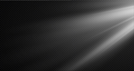 Spotlight on the stage or divine particle rays isolated on a black transparent background. The glow of the rays