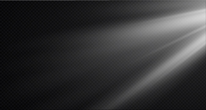 Spotlight on the stage or divine particle rays isolated on a black transparent background. The glow of the rays