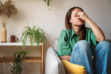 Female person suffering from headache and mental health problems