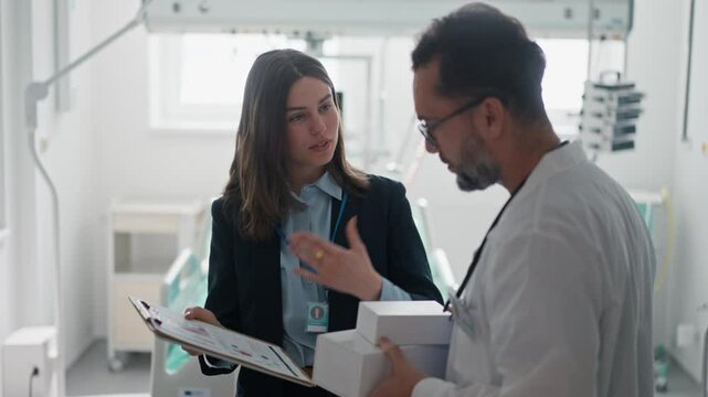 Pharmaceutical sales respresentative with doctor.