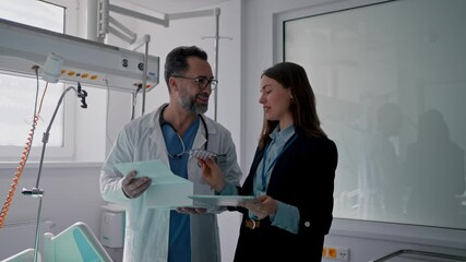 Pharmaceutical sales respresentative with doctor.