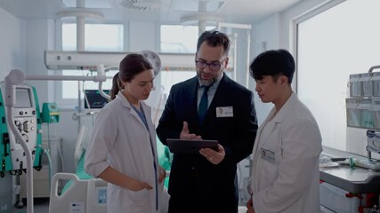 Pharmaceutical sales respresentatives showing doctor new medications. Group presentation in hospital setting.