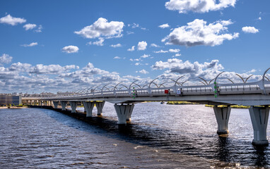 yacht bridge St. Petersburg. A concrete bridge with pillars across the bay.