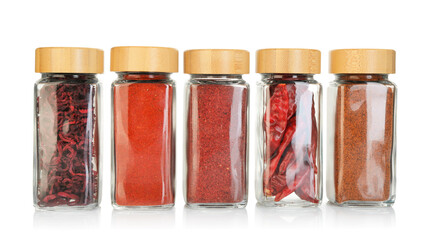 Many different aromatic spices in jars isolated on white