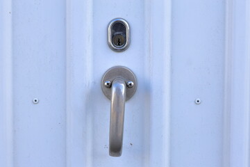 Handle with lock at a garage door.