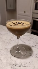 espresso martini with coffee beans floating top.