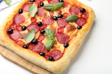 Tasty homemade pizza on white table, closeup
