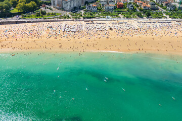 Aerial view of Ondarreta Beach with turquoise waters in San Sebastian or Donostia city, Basque Country, Spain