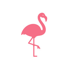 Fototapeta premium Vibrant pink flamingo standing gracefully by a serene water body in a lush landscape