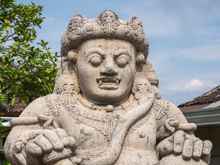 Closeup portrait view of ancient giant monolith statue of dvarapala or guardian protector, Singhasari palace, Singosari, Malang, East Java, Indonesia