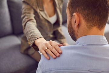 Hand on shoulder support kind gesture, woman caring touching man expressing empathy. Psychologist , psychiatrist comforting at meeting, help, family care, assistance provided, understanding spouse