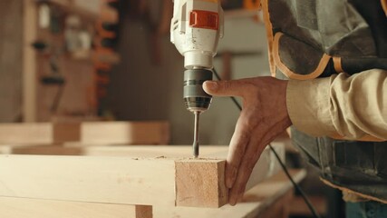 Wood, sander and carpenter in workshop with tools for furniture, production or construction project. Handyman, building and woodworking process in warehouse with manufacturing or labor in business
 - Powered by Adobe