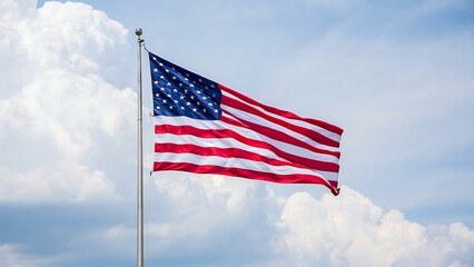 Obraz premium American Flag Waving Proudly Against Blue Sky