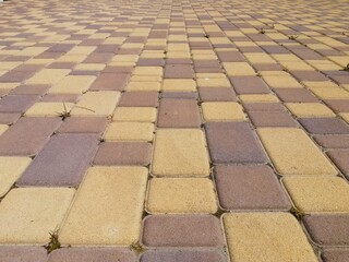 Urban walkway made of decorative colored pavement blocks, combining functionality and visual...