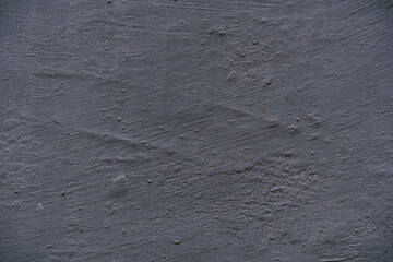 Light grey rough slate scratch background or texture.