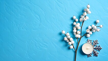 Winter wonderland scene with candle and white berries