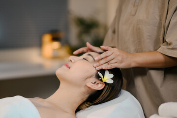 Closeup Attractive Woman Enjoying Face Massage. Beauty procedure