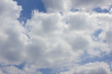 Blue sky with puffy clouds