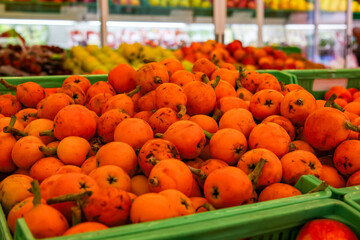 Fresh seasonal loquats on display in a Spanish fruit shop