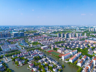 Aerial view of urban scenery in the suburbs of Shanghai, neatly planned residential area on sunny day.