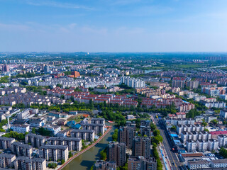 Fototapeta premium Aerial view of urban scenery in the suburbs of Shanghai, neatly planned residential area on sunny day.