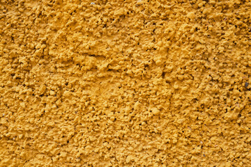 Rough yellow stucco wall texture