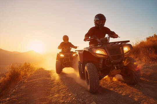 men riding all terrain vehicles on dusty trail during sunset in outdoor adventure activity exciting and dynamic