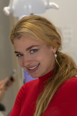 Dental clinic visit featuring a woman smiling brightly with confidence