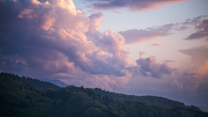 Colorful Sunset Clouds Over Mountain Ridge Landscape
