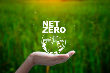 Net zero, carbon neutrality concept. Carbon Sequestration Icon at Hand and Green energy icon around...