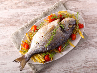 stream bream, dorada fish with beans and tomato